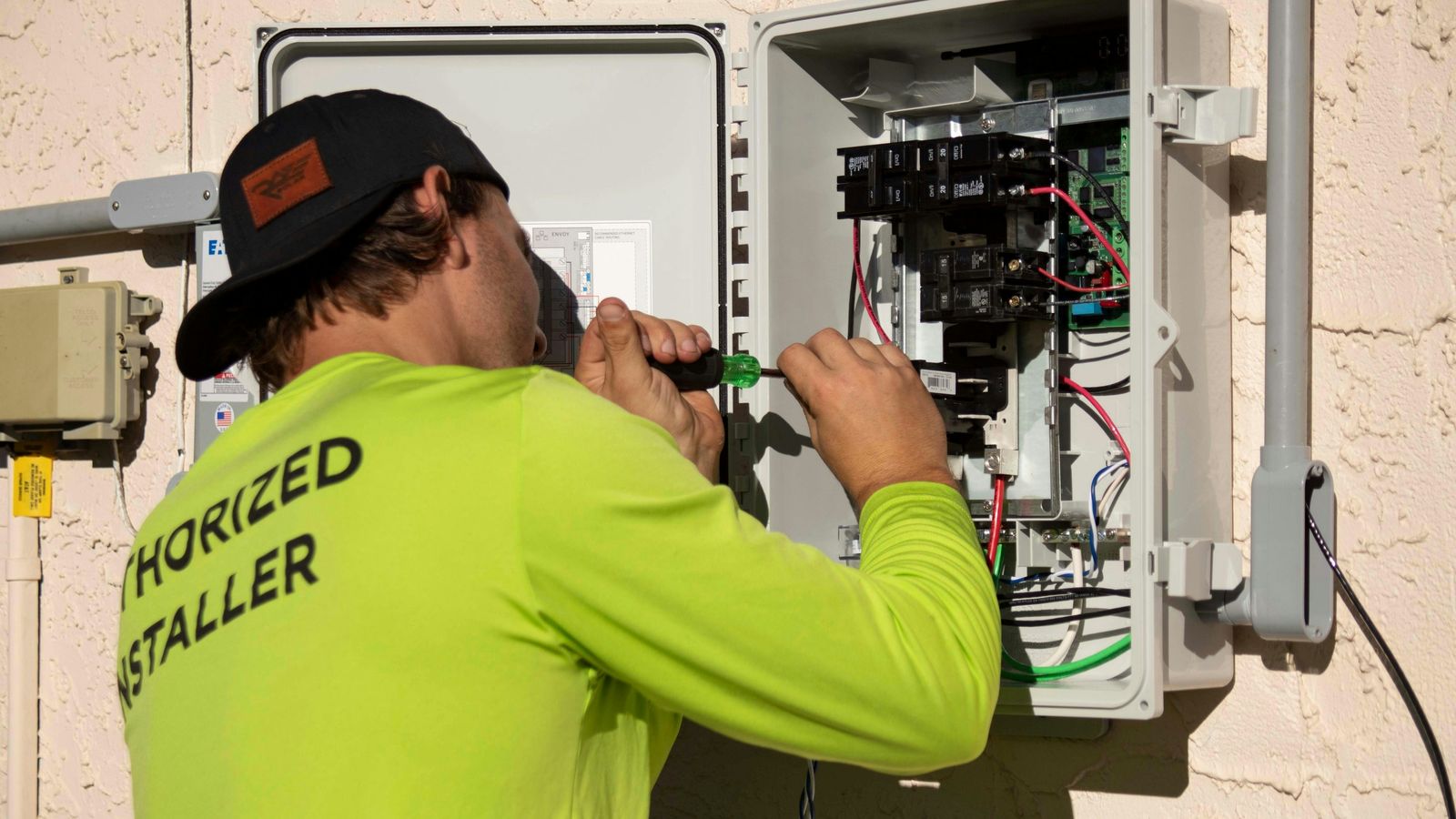 Electrician working on a wiring panel
